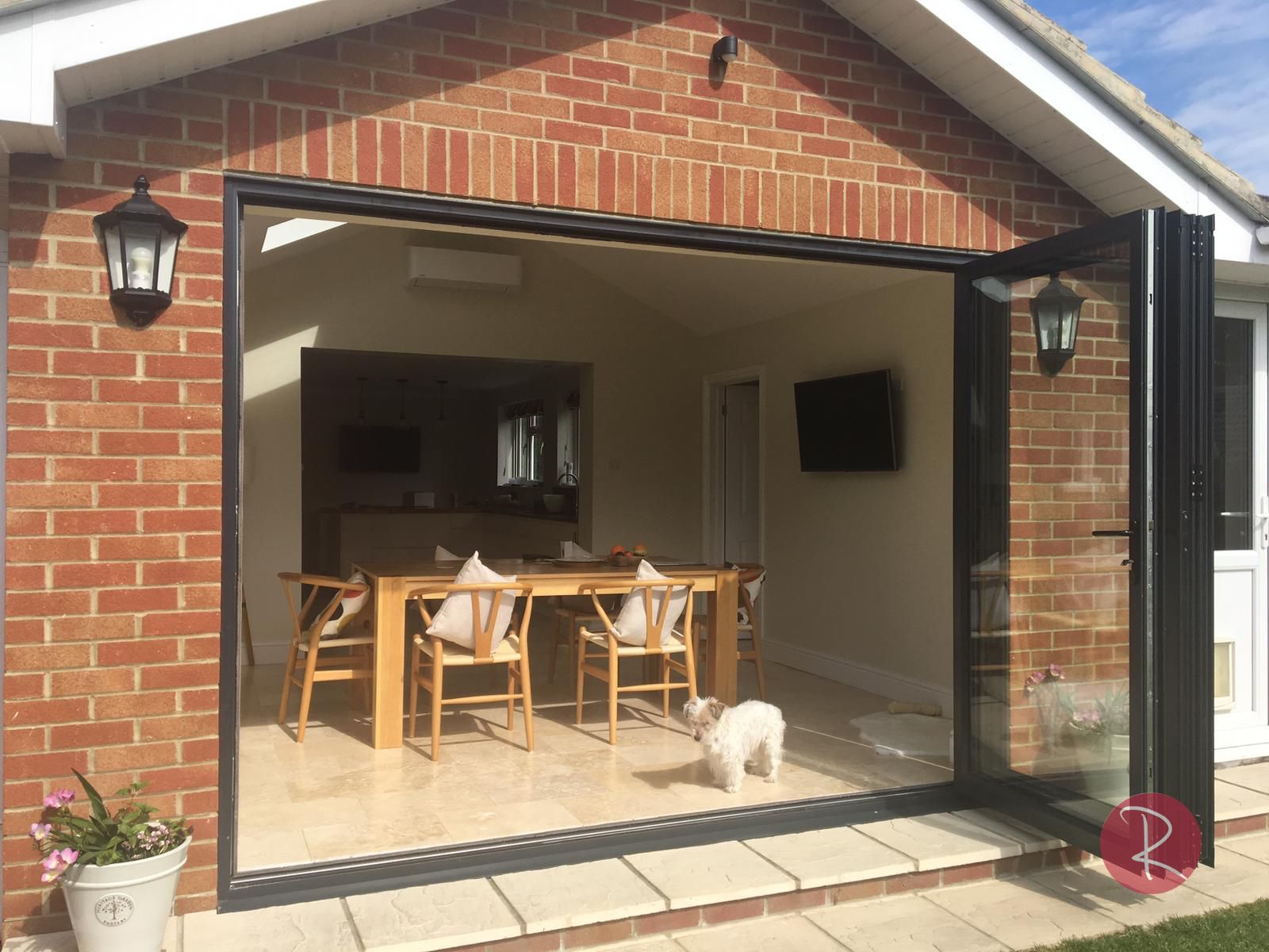 Fully open black aluminium bifold doors
