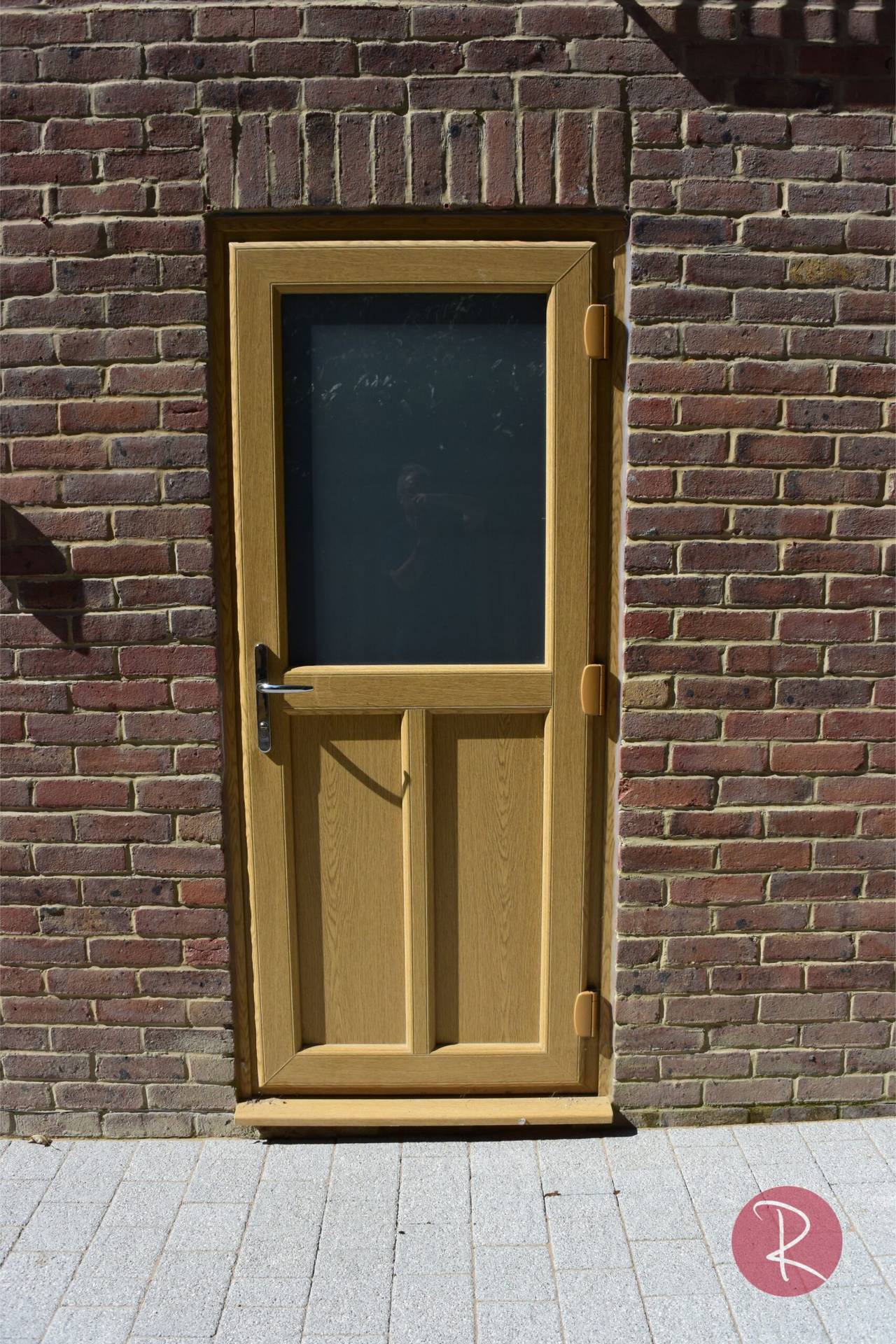 light brown double glazed woodgrain residential front door