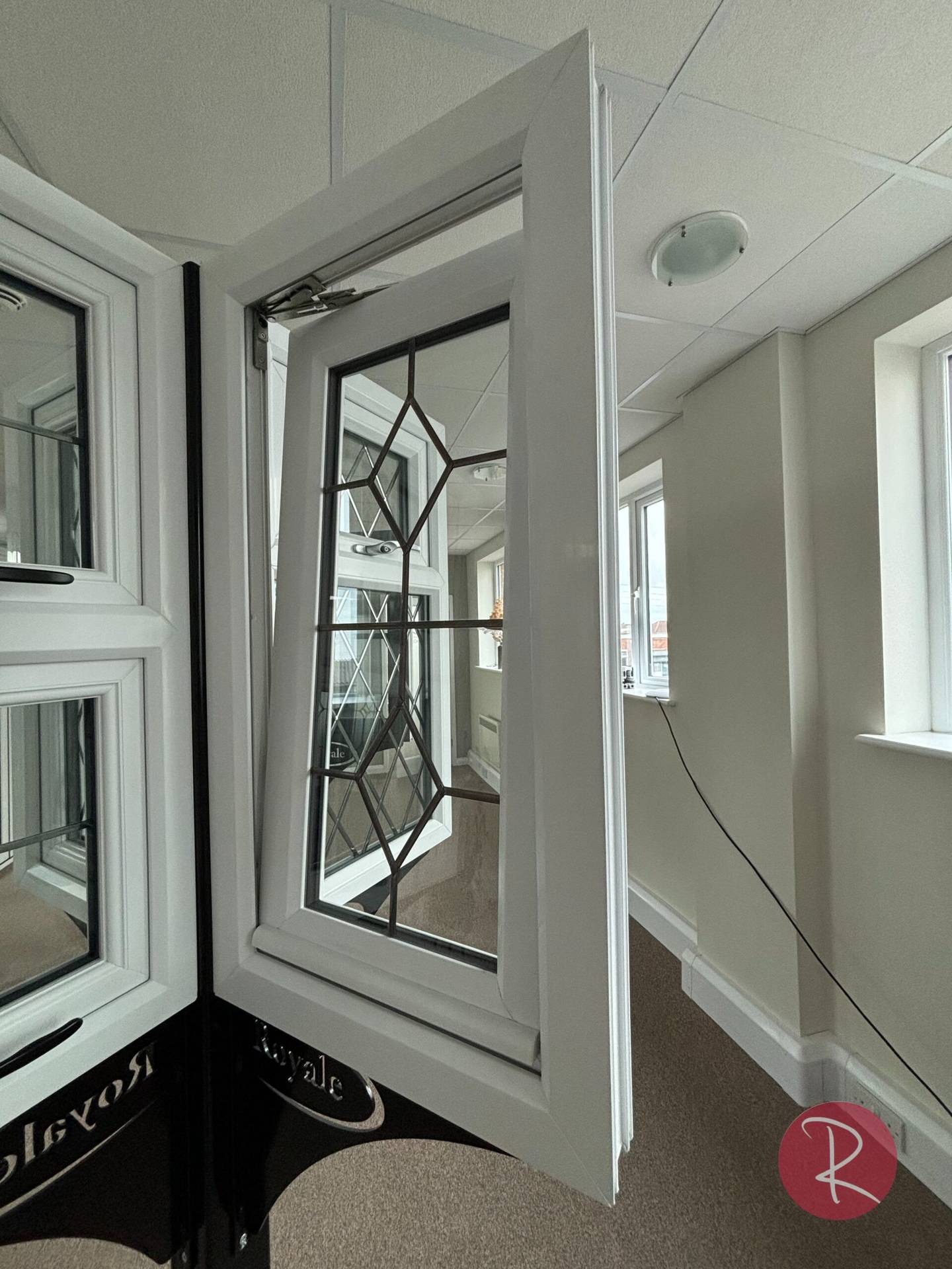White PVCu chamfered windows in showroom