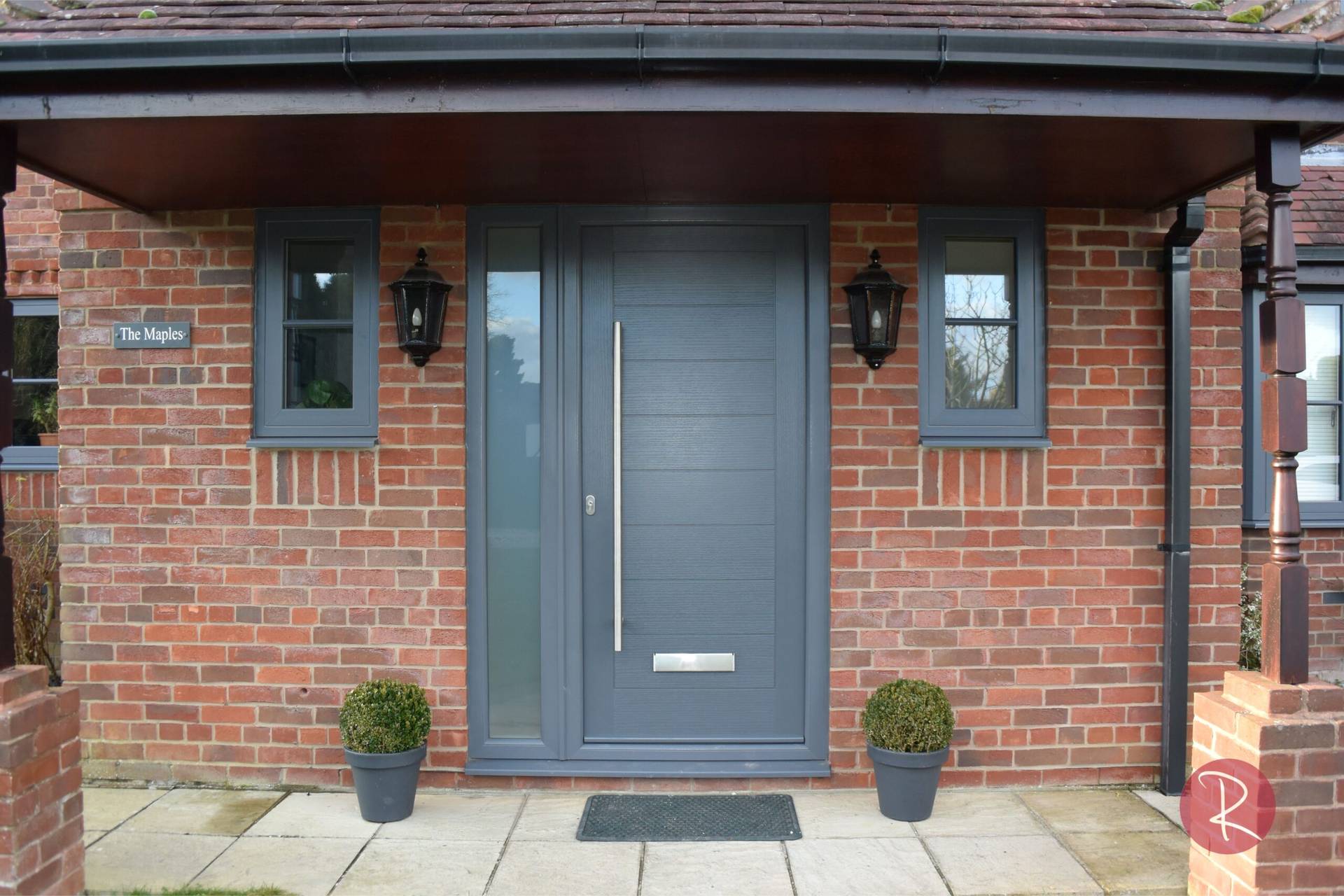 grey composite door with pole handle